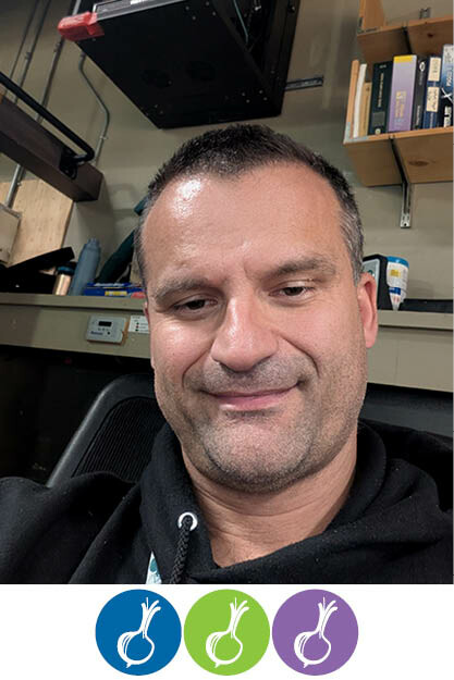 Headshot of Ertan Barucic with 3 onions