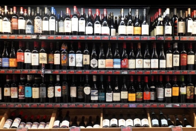 bottles of wine on grocery shelf