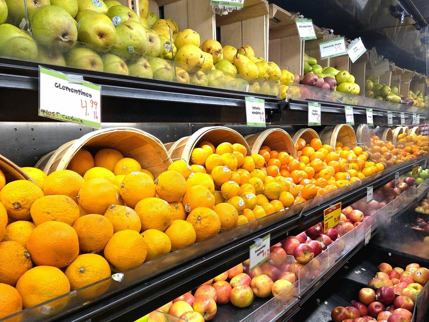 fruits on a shelf in a grocery store