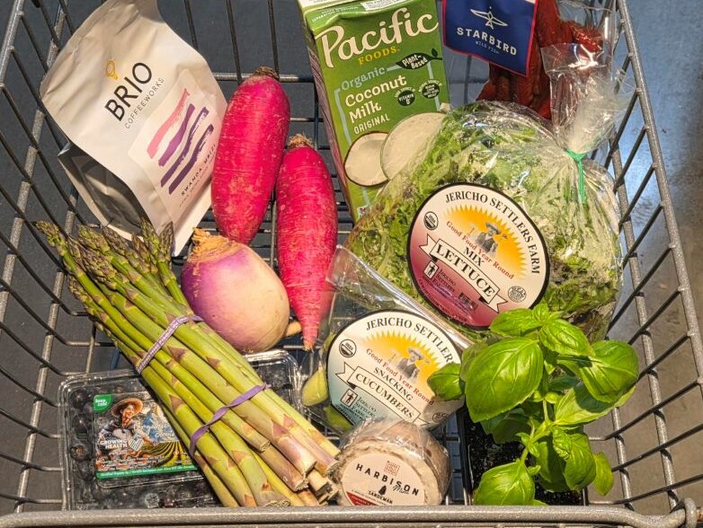 A grocery cart full of food