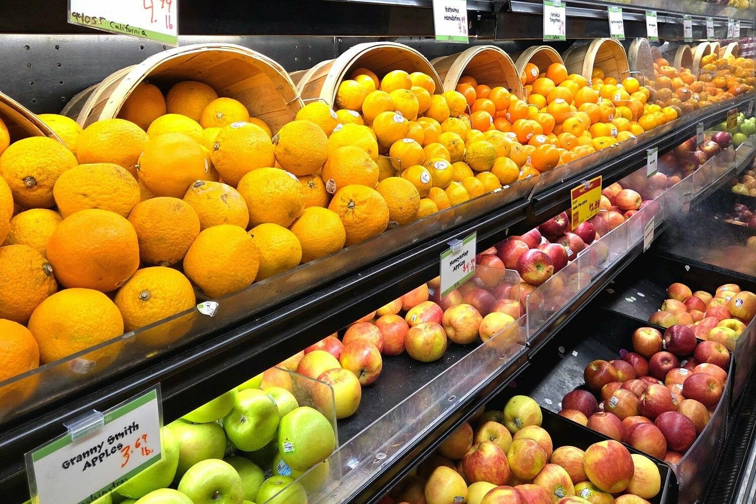 fruits on a shelf in a grocery store