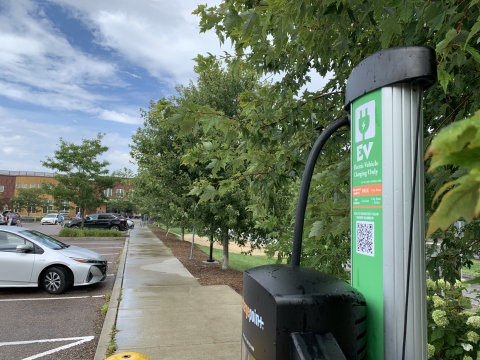 A photo of a ChargePoint EV charging station outside the South End City Market location.